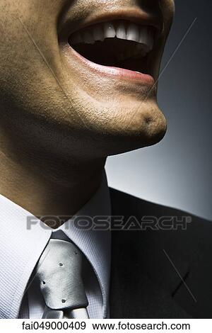 Stock Photo - Man laughing, close-up. Fotosearch