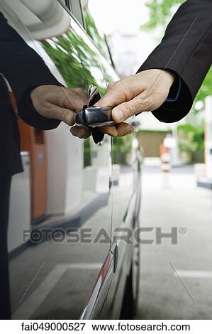 Opening car door View Large Photo Image Stock Photo - Opening car door. Fotosearch