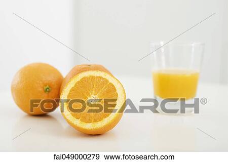 Oranges and glass of orange juice View Large Photo Image Stock Photo - Oranges and glass of orange juice. Fotosearch