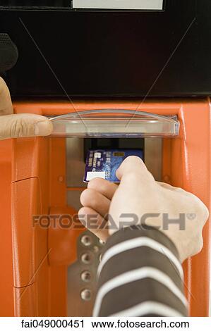 Paying at the gas pump, using credit card reader View Large Photo Image Stock Image - Paying at the gas pump, using credit card reader. Fotosearch