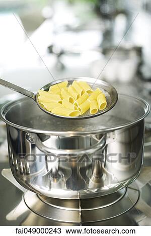 Penne pasta cooked al dente View Large Photo Image Stock Image - Penne pasta cooked al dente. Fotosearch