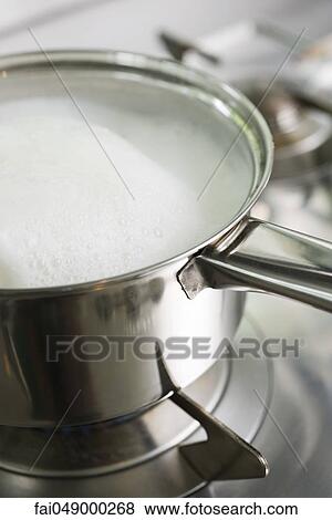 Pot cooking on stove View Large Photo Image Stock Photo - Pot cooking on stove. Fotosearch