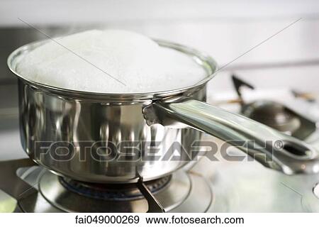 Pot cooking on stove View Large Photo Image Stock Photo - Pot cooking on stove. Fotosearch