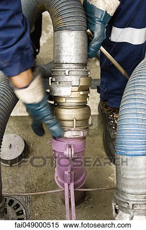 Stock Photography - Preparing to fill gas station fuel storage tanks. Fotosearch