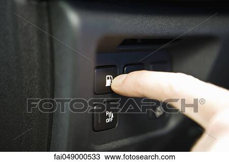 Pressing gas tank button on dashboard keypad View Large Photo Image Stock Image - Pressing gas tank button on dashboard keypad. Fotosearch