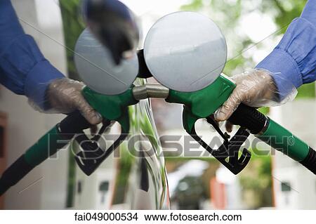 Picture - Refueling vehicle at gas station. Fotosearch