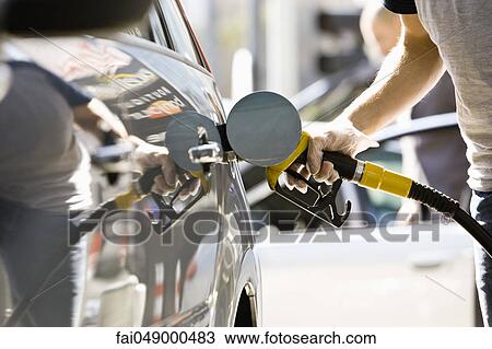 Refueling vehicle at gas station View Large Photo Image Stock Image - Refueling vehicle at gas station. Fotosearch