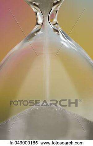 Sand passing through hourglass, close-up View Large Photo Image Stock Photography - Sand passing through hourglass, close-up. Fotosearch