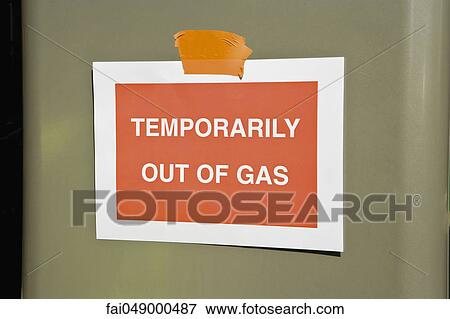 Stock Photo - Sign at gas station reading "Temporarily out of gas". Fotosearch
