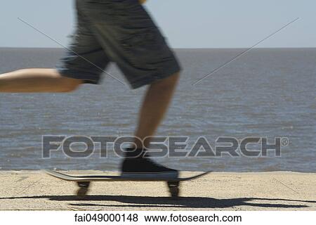 Skateboarding at seaside park View Large Photo Image Stock Photo - Skateboarding at seaside park. Fotosearch