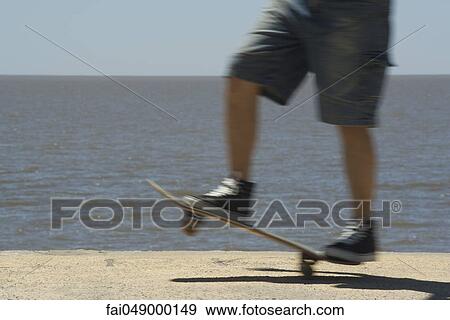 Skateboarding at seaside park View Large Photo Image Stock Photo - Skateboarding at seaside park. Fotosearch