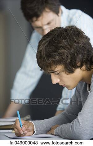 Student working with tutor's supervision View Large Photo Image Stock Photo - Student working with tutor's supervision. Fotosearch