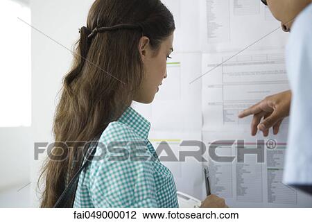 Students checking bulletin board View Large Photo Image Stock Image - Students checking bulletin board. Fotosearch