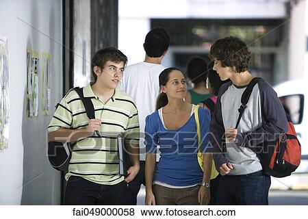Students walking and chatting together View Large Photo Image Stock Photo - Students walking and chatting together. Fotosearch