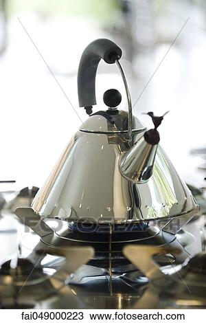 Tea kettle heating on gas stove View Large Photo Image Stock Image - Tea kettle heating on gas stove. Fotosearch
