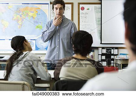Teacher listening to student's question View Large Photo Image Stock Image - Teacher listening to student's question. Fotosearch