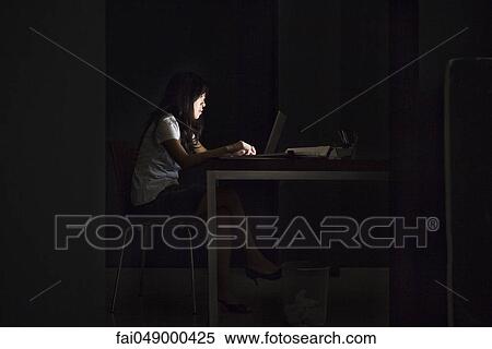 Woman in office working late View Large Photo Image Stock Photography - Woman in office working late. Fotosearch