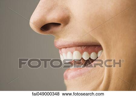 Woman laughing, side view View Large Photo Image Stock Photo - Woman laughing, side view. Fotosearch