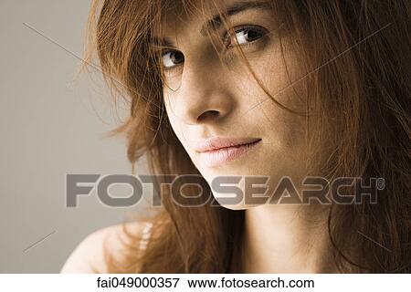 Woman looking provocatively at camera View Large Photo Image Stock Photo - Woman looking provocatively at camera. Fotosearch