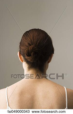 Woman with hair arranged in chignon, rear view View Large Photo Image Stock Image - Woman with hair arranged in chignon, rear view. Fotosearch