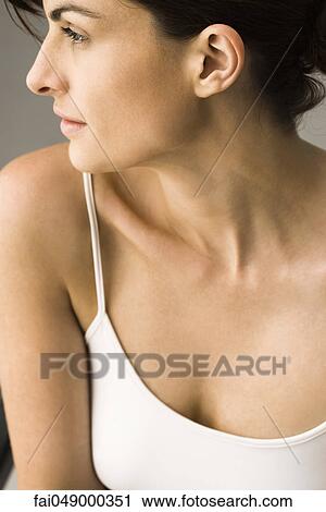 Young woman contemplatively looking away View Large Photo Image Stock Image - Young woman contemplatively looking away. Fotosearch
