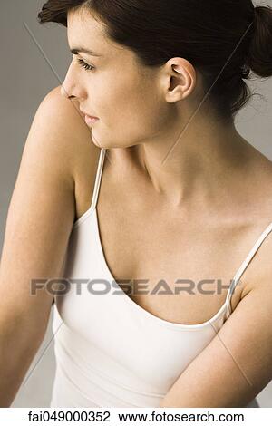 Young woman contemplatively looking away View Large Photo Image Stock Image - Young woman contemplatively looking away. Fotosearch