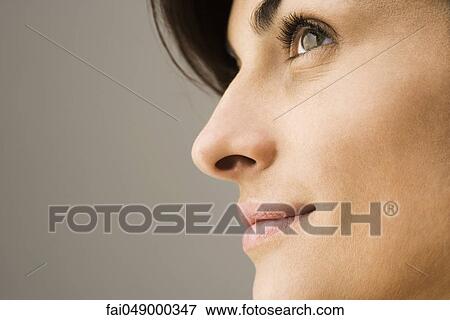 Young woman contemplatively looking away, profile View Large Photo Image Stock Photo - Young woman contemplatively looking away, profile. Fotosearch