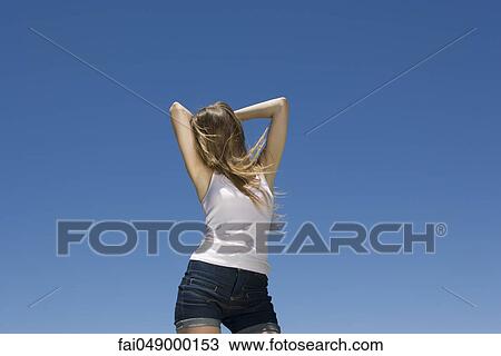 Young woman dancing outdoors View Large Photo Image Stock Image - Young woman dancing outdoors. Fotosearch