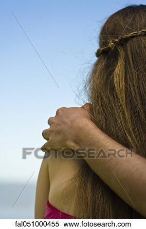 Stock Photography - Arm around shoulder, looking at view. Fotosearch