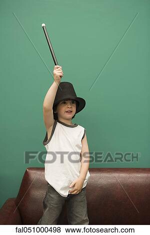 Boy pretending to be magician View Large Photo Image Stock Photo - Boy pretending to be magician. Fotosearch