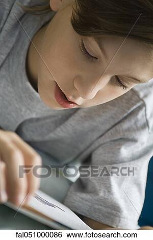 Boy reading book View Large Photo Image Stock Photograph - Boy reading book. Fotosearch