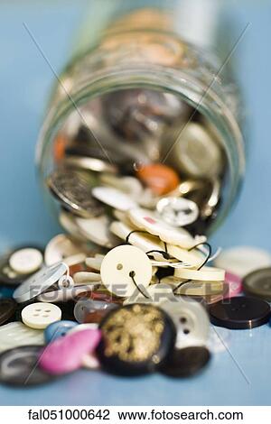 Buttons spilling out of jar View Large Photo Image Stock Image - Buttons spilling out of jar. Fotosearch