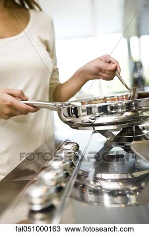 Cooking on gas stove View Large Photo Image Stock Image - Cooking on gas stove. Fotosearch