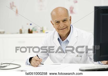 Doctor at work in office View Large Photo Image Stock Photo - Doctor at work in office. Fotosearch