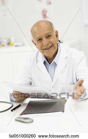 Doctor conducting medical consultation View Large Photo Image Stock Image - Doctor conducting medical consultation. Fotosearch