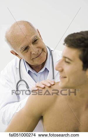 Doctor conducting medical exam View Large Photo Image Picture - Doctor conducting medical exam. Fotosearch