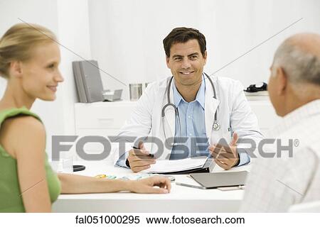 Doctor with senior patient providing medical consultation View Large Photo Image Stock Photography - Doctor with senior patient providing medical consultation. Fotosearch