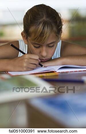 Elementary school student concentrating on school work View Large Photo Image Stock Image - Elementary school student concentrating on school work. Fotosearch