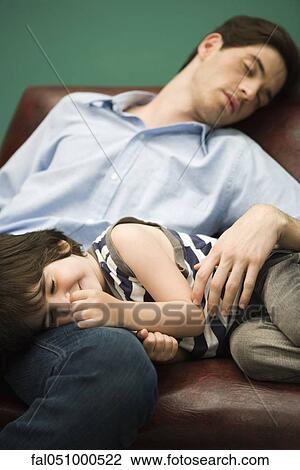 Father and son napping together on sofa View Large Photo Image Stock Image - Father and son napping together on sofa. Fotosearch