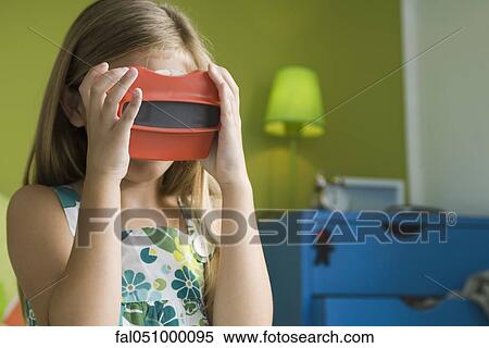 Girl looking through toy viewfinder View Large Photo Image Stock Photography - Girl looking through toy viewfinder. Fotosearch
