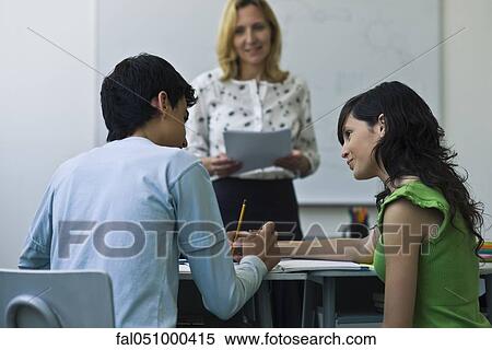 High school classmates helping each other in class View Large Photo Image Stock Photography - High school classmates helping each other in class. Fotosearch
