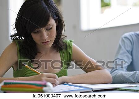 Stock Photo - High school student doing classwork. Fotosearch
