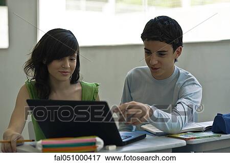 High school students using laptop computer in class View Large Photo Image Stock Photo - High school students using laptop computer in class. Fotosearch
