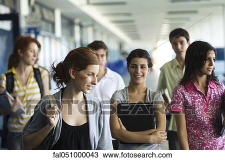 High school students walking along school corridor together View Large Photo Image Stock Image - High school students walking along school corridor together. Fotosearch
