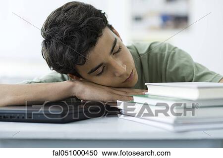 Male high school student napping at desk View Large Photo Image Stock Image - Male high school student napping at desk. Fotosearch