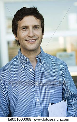Man carrying documents under arm, portrait View Large Photo Image Stock Photo - Man carrying documents under arm, portrait. Fotosearch