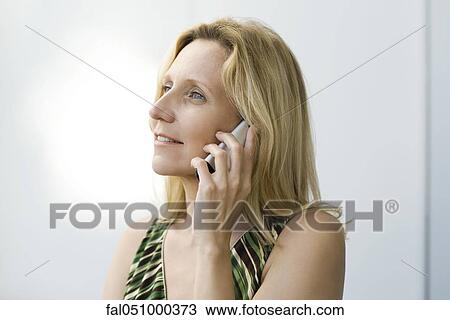 Mature woman using cell phone View Large Photo Image Stock Image - Mature woman using cell phone. Fotosearch
