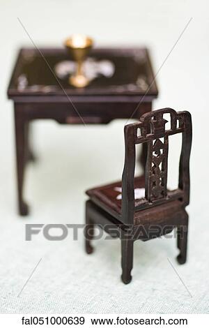 Stock Photo - Miniature chair and table. Fotosearch
