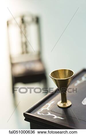 Miniature cup on table View Large Photo Image Stock Photograph - Miniature cup on table. Fotosearch