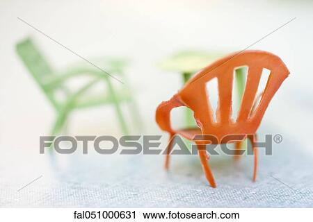 Miniature plastic chairs View Large Photo Image Stock Image - Miniature plastic chairs. Fotosearch